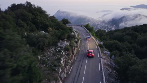 Old-vintage-car-driving-in-the-French-mountains-outside-Monaco