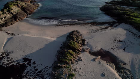 aerial revealing shot of a sandy beach along the scenic route andoya, vesteralen