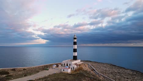 lighthouse at the edge of a cliff in spain