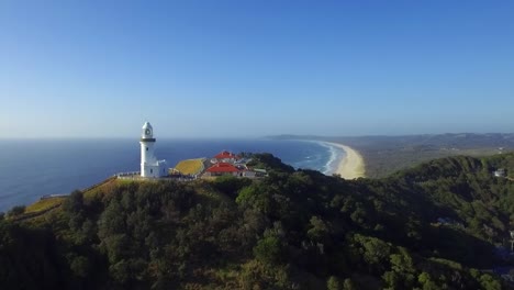 aerial drone view over the cape byron lighthouse complex and south along the coast