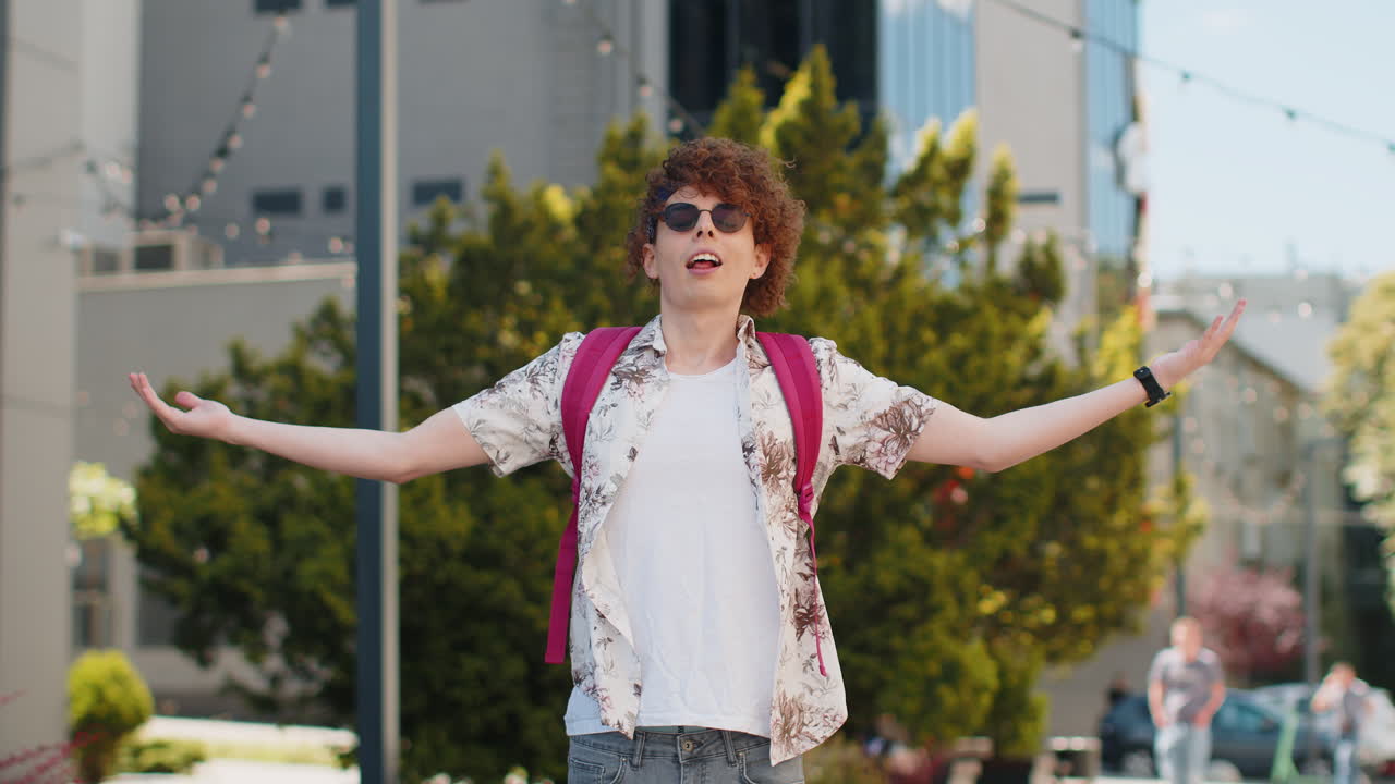 Caucasian young tourist man meditating breathes deeply fresh air taking a break in urban city street