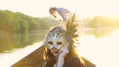beautiful woman riding on gondola. girl is swimming in a boat