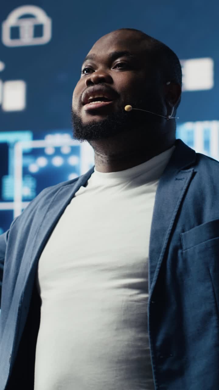Professional Black Man Speaking and Gesturing at a Technology Conference