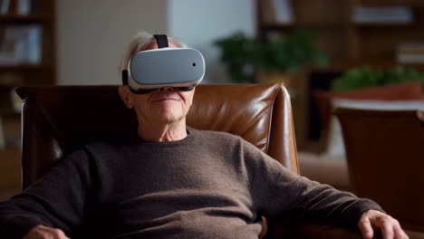 senior man using vr headset at home