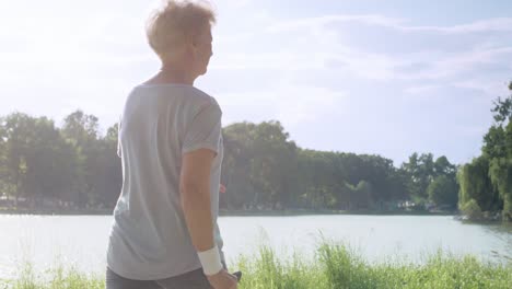 senior woman practicing nordic walking  in the park