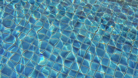 Water-ripples-and-shines-over-the-tiles-at-the-bottom-of-the-pool