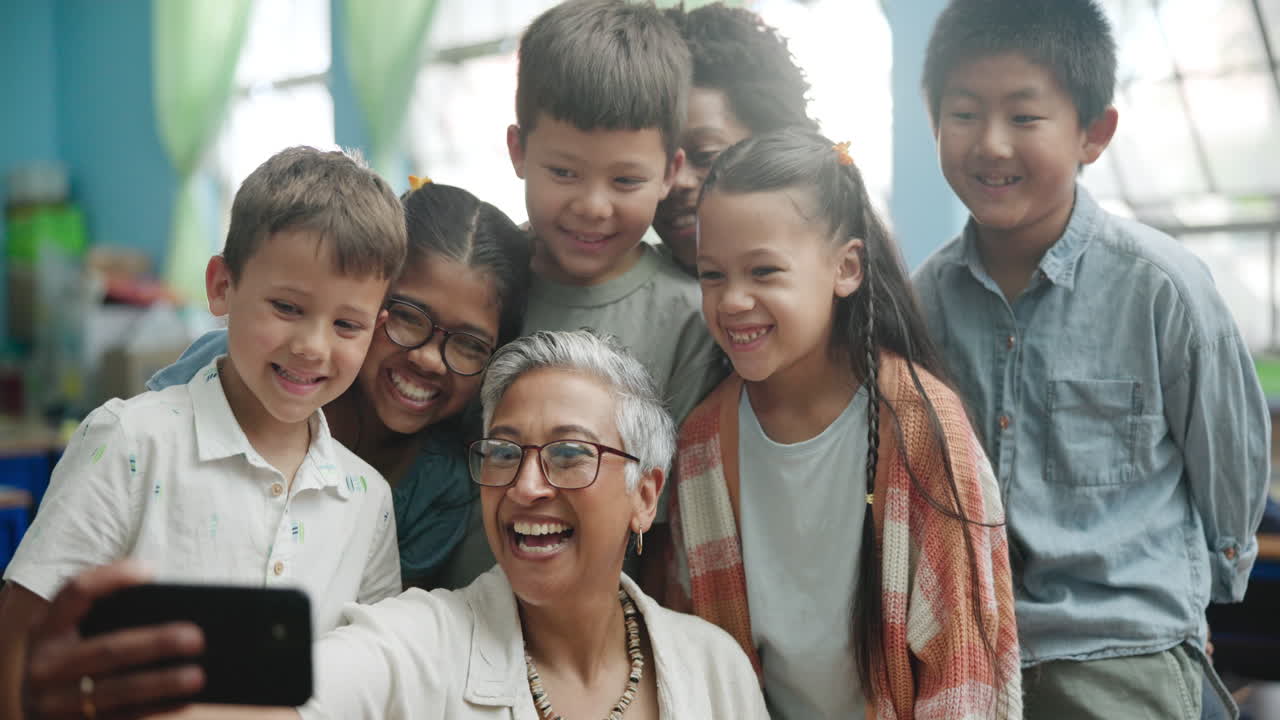 Teacher and students taking a selfie in classroom