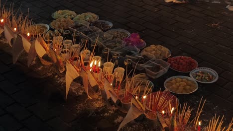 food offerings and rituals at a street ceremony