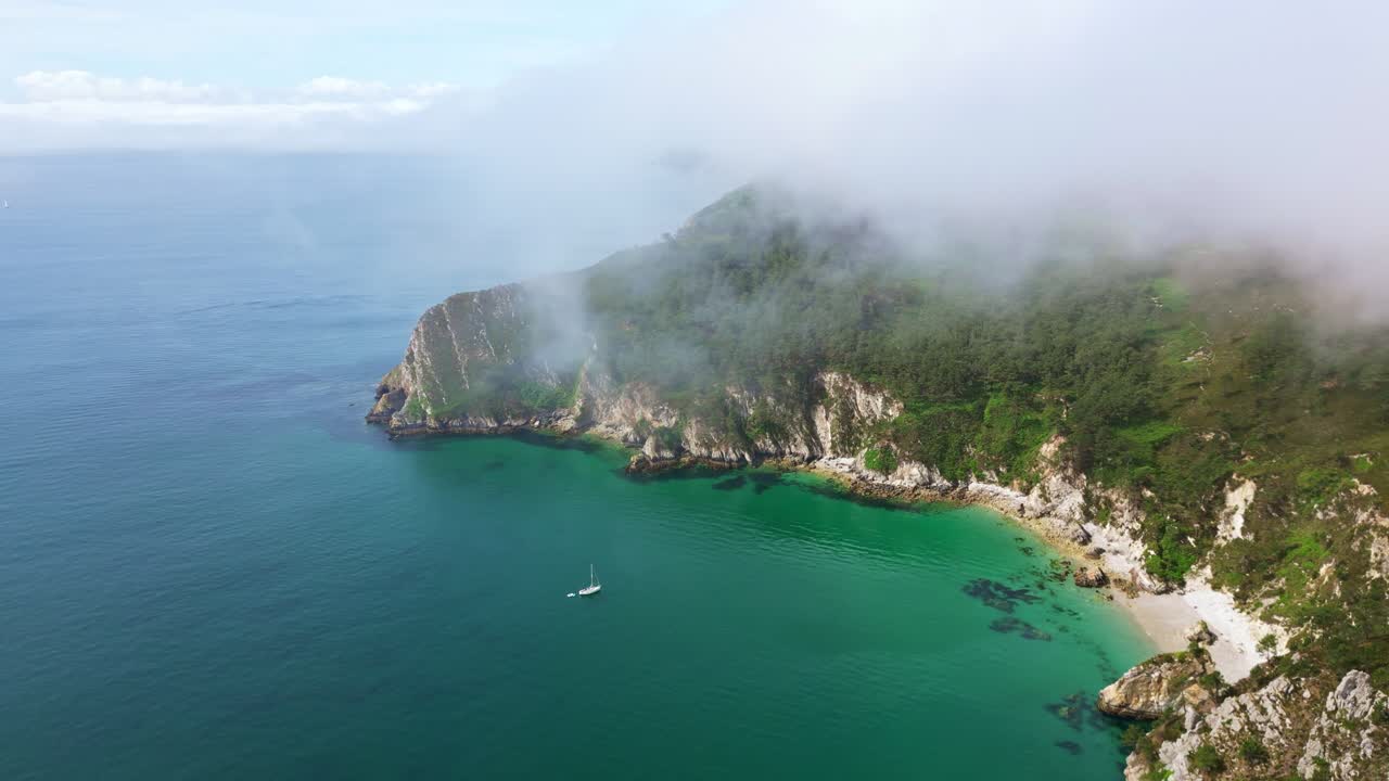 Amazing drone view of Crozon peninsula aka Presqu'ile de Crozon coastal cliffs partially covered in dramatic misty clouds environment, Brittany, France
