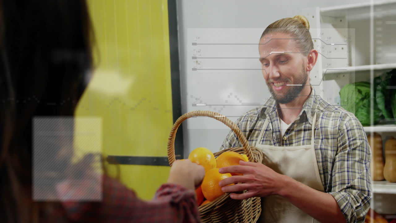 Assisting customer with basket of oranges, man working in grocery store