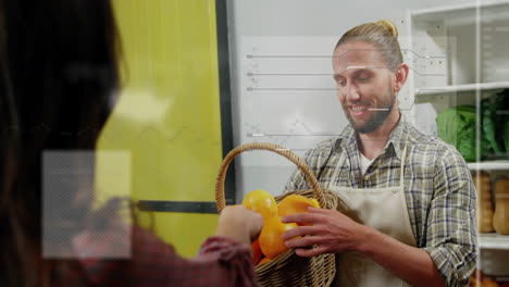 assisting customer with basket of oranges, man working in grocery store