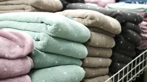 Close-up-of-stack-of-shower-towel-on-table,