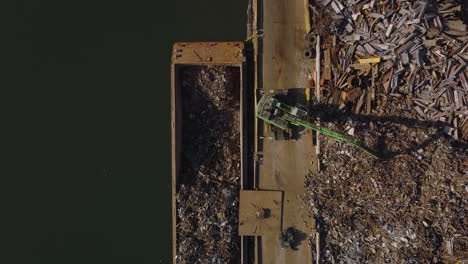 Aerial-birds-eye-overhead-top-down-ascending-shot-of-transferring-material-waste-material-of-further-usage.-Recycle-and-ecology-concept.-New-York-City,-USA