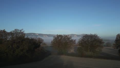 sea of fog descending and covering everything in autumn near vic, barcelona, spain
