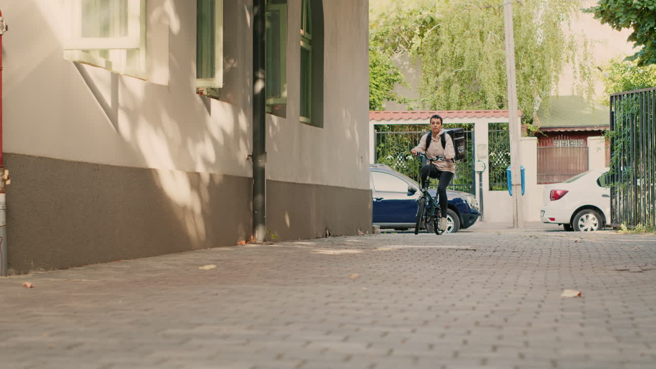 A female bike messenger rides her bike
