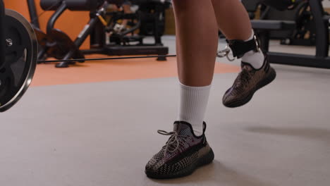leg workout with cable machine in a gym