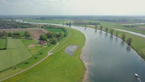 Aerial-drone-view-of-flying-over-the-river-in-the-Netherlands,-Europe