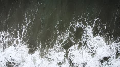 Overhead-Shot-Of-Surfer-Hit-By-Strong-Wave-And-Riding-Again-His-Board