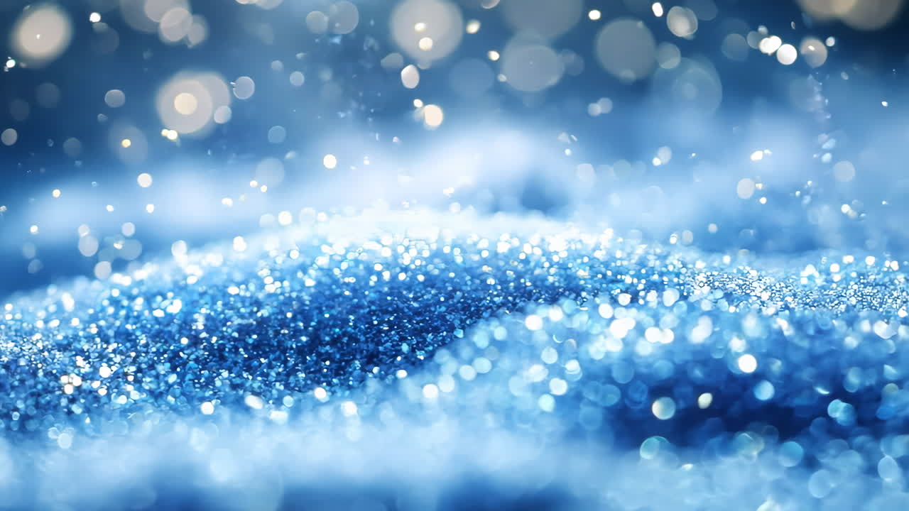 A snow covered hill with a blue sky in the background. The snow is sparkling and the sky is clear