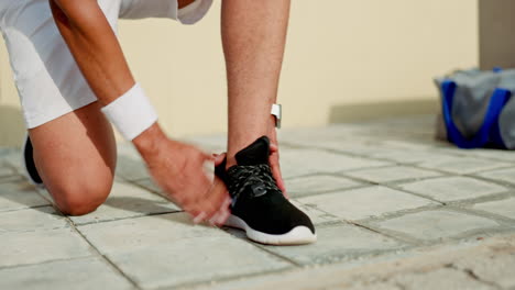 man, hands and shoe lace tie in city fitness