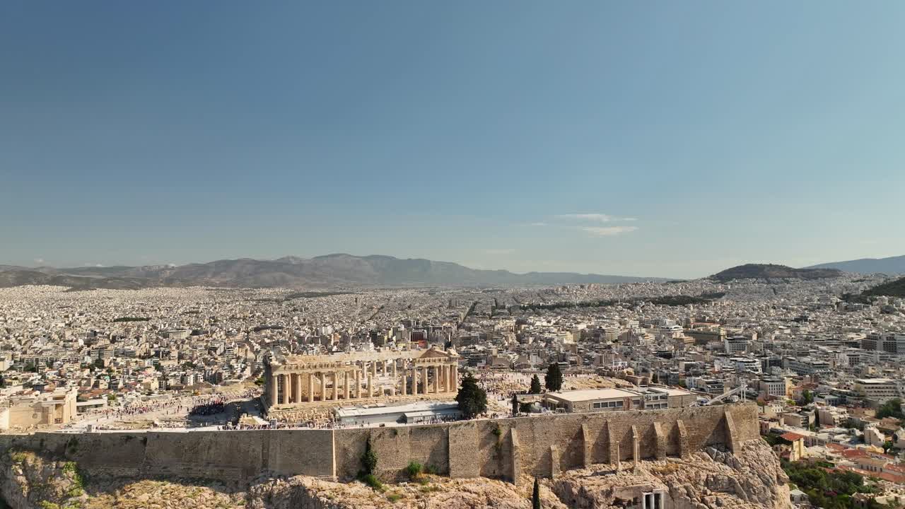Parthenon hilltop landmark in Athens, captured in crystal-clear UHD aerial view under summer skies with panoramic perspective of the Greek capital.