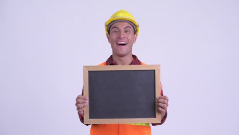 young handsome hispanic man construction worker