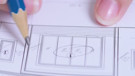 an artist meticulously sketches plans for a contemporary building showcasing creativity and attention to detail