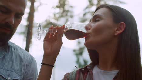 positive friends clinking glasses on backyard. friends having fun on bbq party