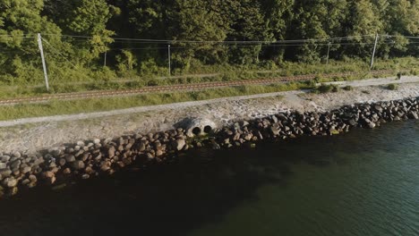 drain pipes by the river and lush green trees