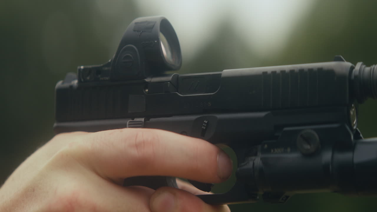 Handgun with Red Dot Sight and Accessories