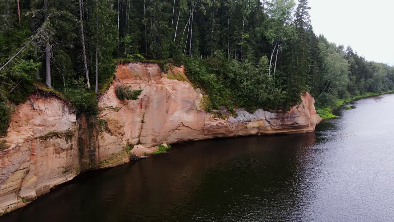 Ērgļu sandstone Cliffs, cliffs in Gauja National Park, Latvia forest, Drone, 4K