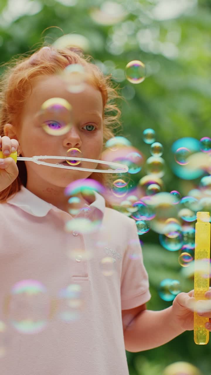 Little Girl Playing with Bubbles