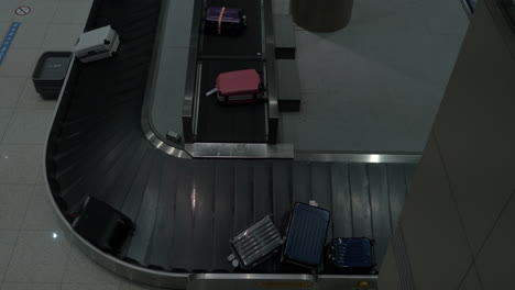 baggage arriving to conveyor belt in the airport