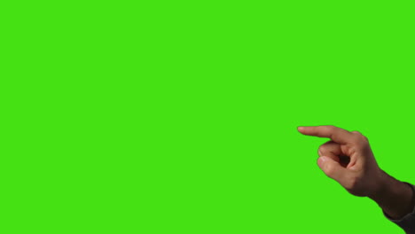 Close Up Of Man's Hand Interacting And Making Control Gestures When Using Virtual Reality Technology Against Green Screen
