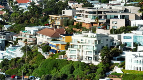 Slider-of-buildings-in-residential-borough.-Guesthouses-and-apartments-in-tropical-destination-on-sunny-day.-Cape-Town,-South-Africa