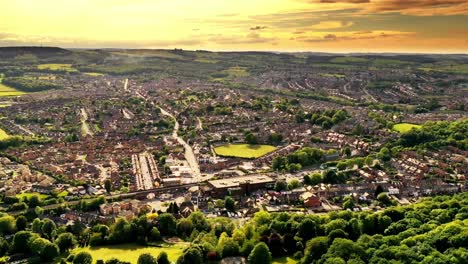 aerial hyperlapse during the golden hour over a countryside town in the uk