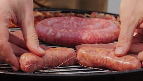 traditional spanish barbeque, big sausage chorizo botifarra, pork and beef ribs on grill with fire, american style cooking, chef grilling meat fat food, steaks and sausages on bbq. high quality 4k footage