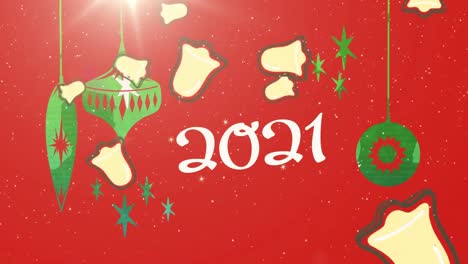 Weihnachtliche-Hängedekorationen-Und-Mehrere-Glockensymbole,-Die-Vor-Dem-Text-„2021“-Auf-Rotem-Hintergrund-Fallen