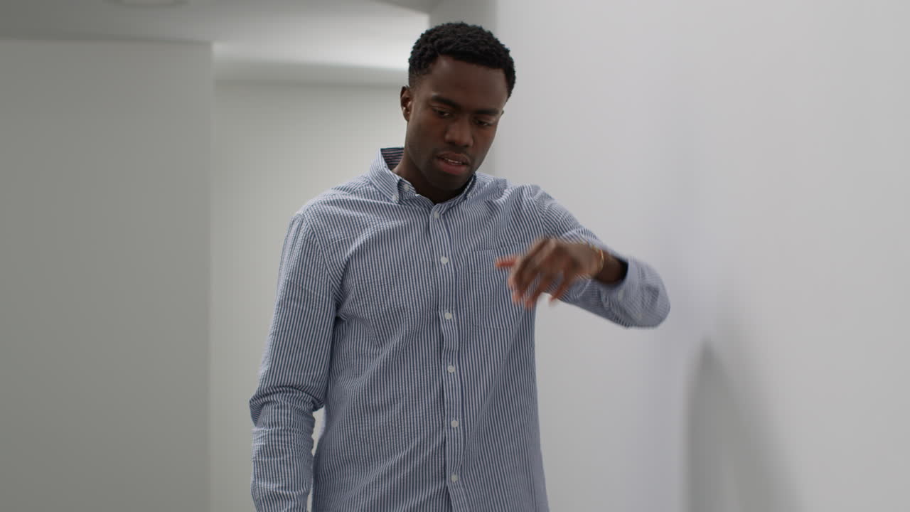 Young Businessman In Office Talking On Mobile Phone Reacting To Bad News Looking Unhappy And Depressed 1