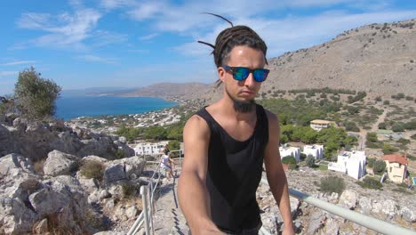 me climbing a stairway to have an amazing view of the beautiful island of rhodes greece in the mediterranean
