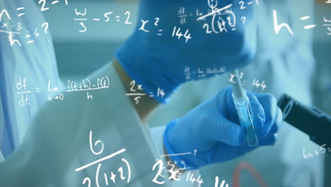 Animation-of-mathematical-equations-over-biracial-male-scientist-working-in-lab