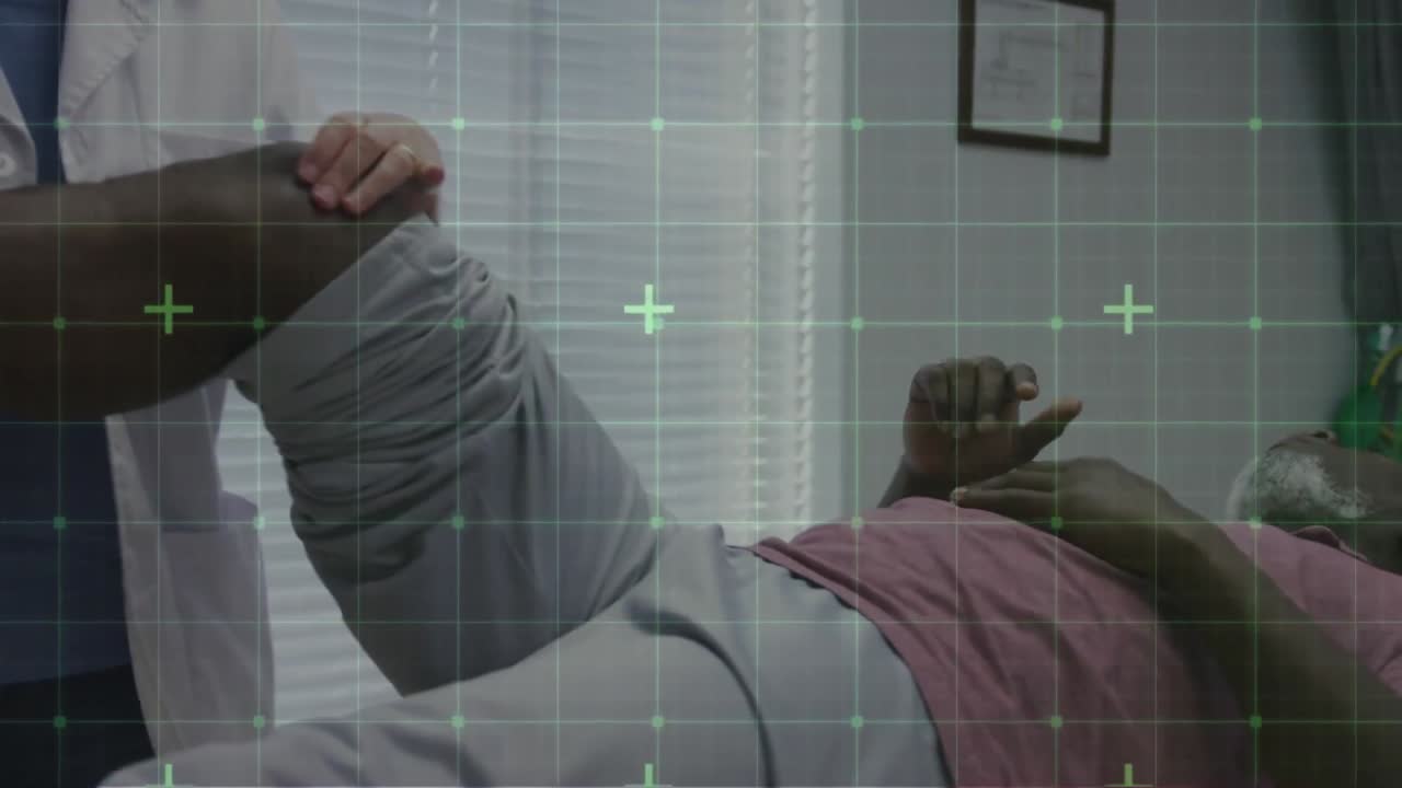 Animation of grid with green markers over female physiotherapist and senior male patient