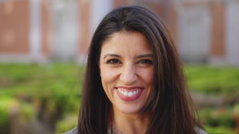 close-up portrait of a smiling woman outdoors