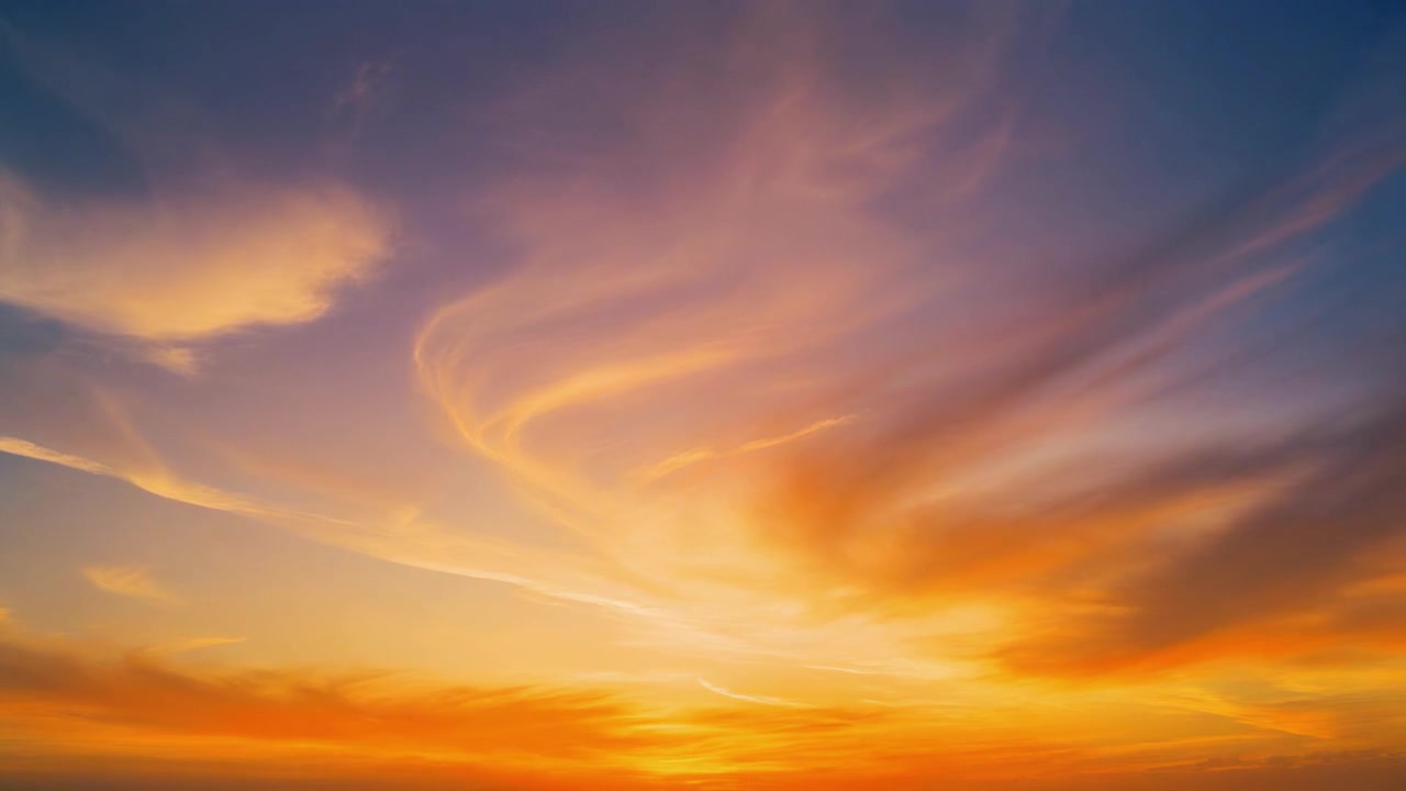 Vibrant Golden Hour Sunset Sky with Wispy Clouds