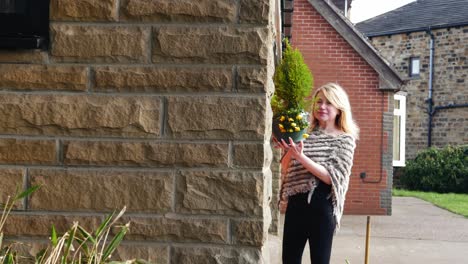 Attractive-woman-enjoying-garden-basket-of-flowers-medium-zoom-in-shot-slow-motion