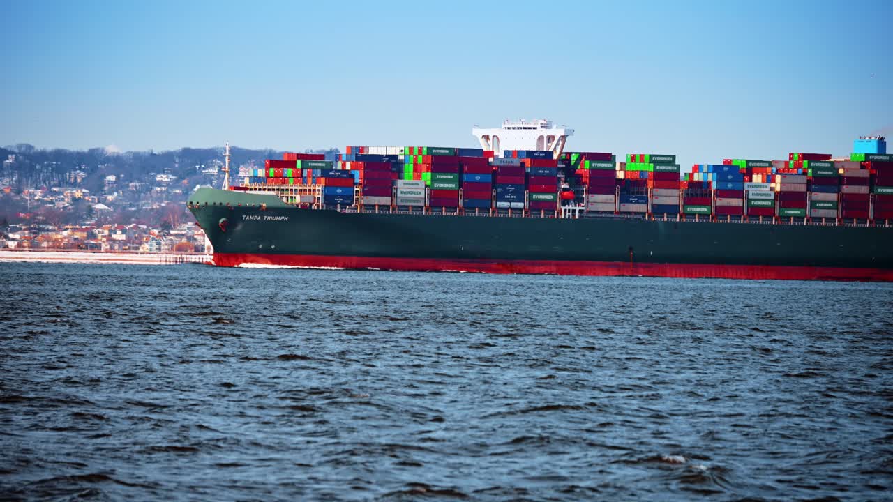 New York, USA, 24 December 2025: Large container ship Tampa Triumph underway. Fully loaded container ship Tampa Triumph moves through New York Harbor waters
