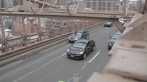 traffic on the brooklyn bridge, populated city concept, slow motion