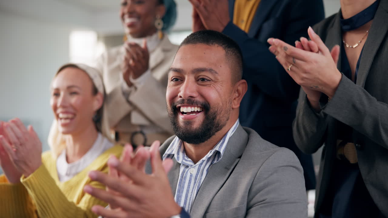 Diverse business team celebrating success with applause