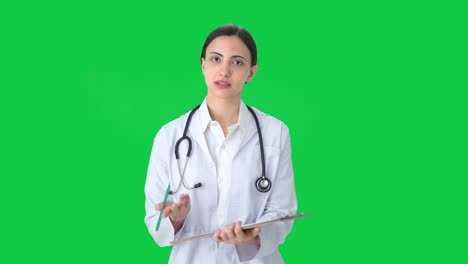 Indian-female-doctor-writing-medicines-for-patient-Green-screen