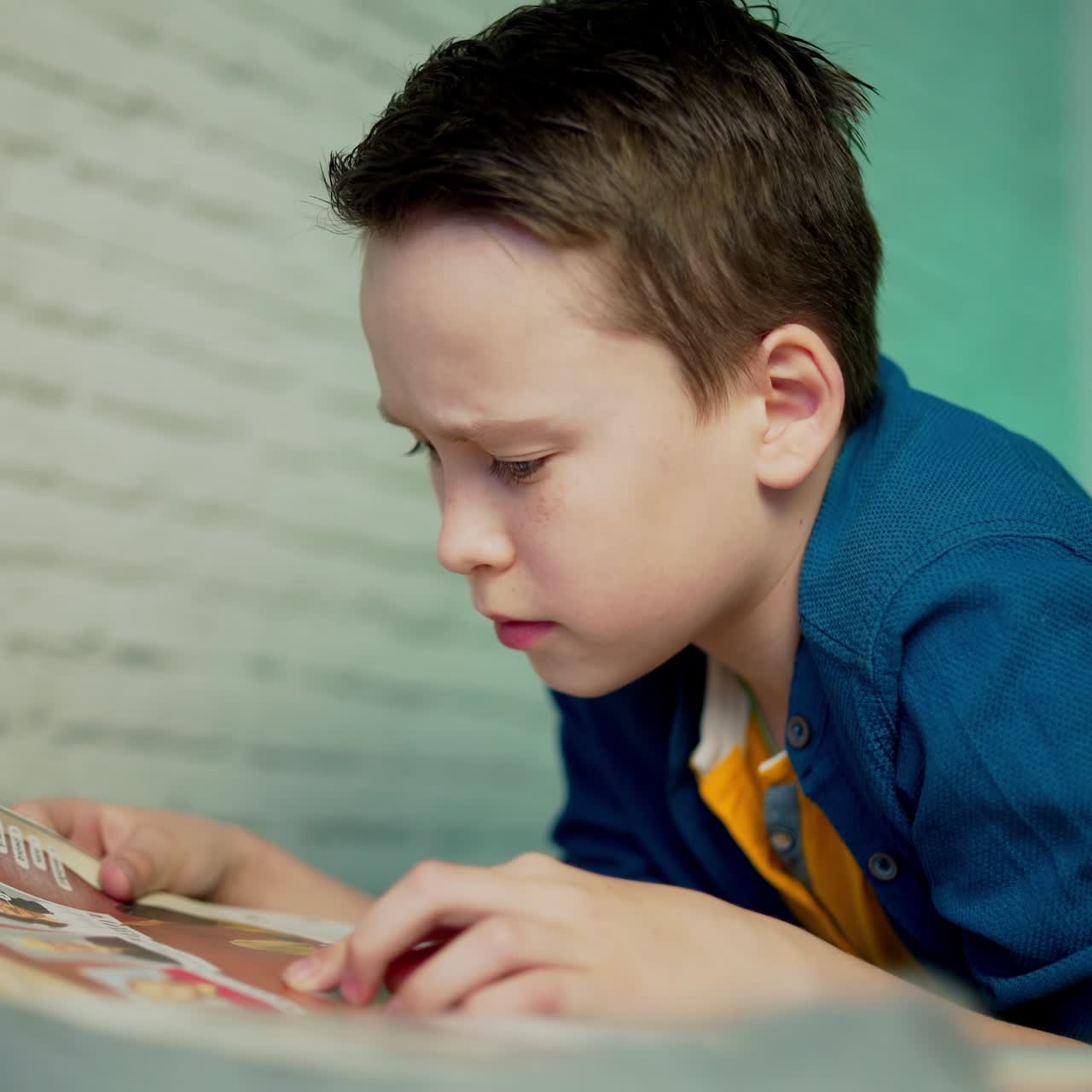 Self isolation concept. Young boy studying from home during Covid-19. All stay at home. Remote studying from home during Quarantine.